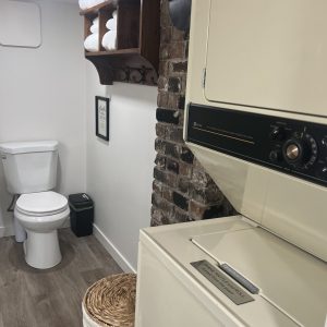 CC-01-10 - Club Car bathroom with full shower and stacking washer and dryer
