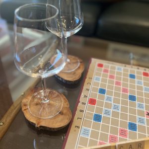 CC-01-17 - Club Car signature evening where vintage Scrabble and wine await on the repurposed travelers trunk coffee table