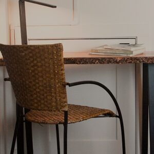 CC-02-03 Forest live-edge desk and woven chair provide a refined workspace