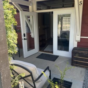 CC-02-01 - Club Car entrance is opening and inviting. Its French doors and vintage trunk show off the heritage soul of the Saltair Station