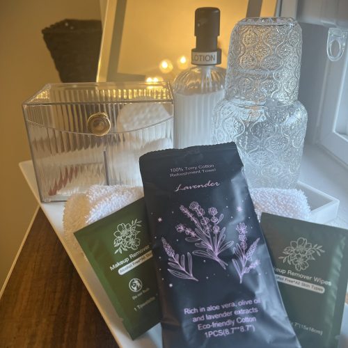 CC-01-06 - Club Car Forest Room featuring a lit makeup mirror, high-end amenities for your stay