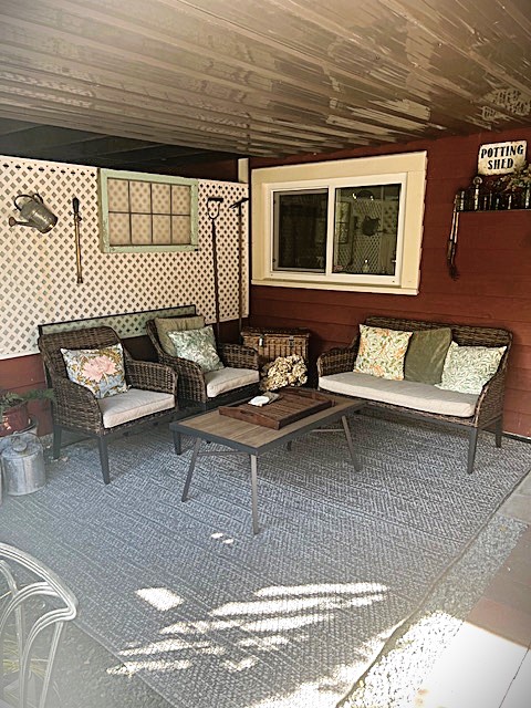 GS-03-16 - Garden Suite exclusive Potting Shed Patio with comfortable lounge seating and garden charm overlooking your own English country garden bed